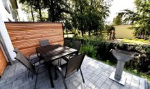 Terrasse mit Grill und Blick auf den Kindergarten