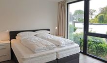 1.Schlafzimmer mit Doppelboxspringbett im Obergeschoss