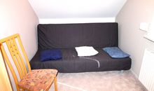 Schlafzimmer mit Futon- und Einzelbett